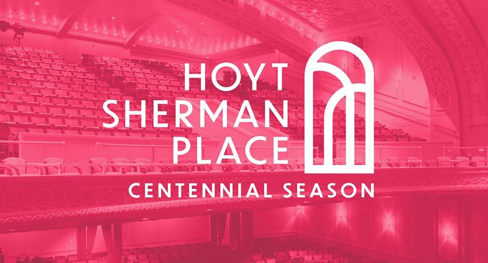 The Hoyt Sherman Place Centennial Season logo overlaid onto a bright pink duotone image of the present day theater as seen from the stage