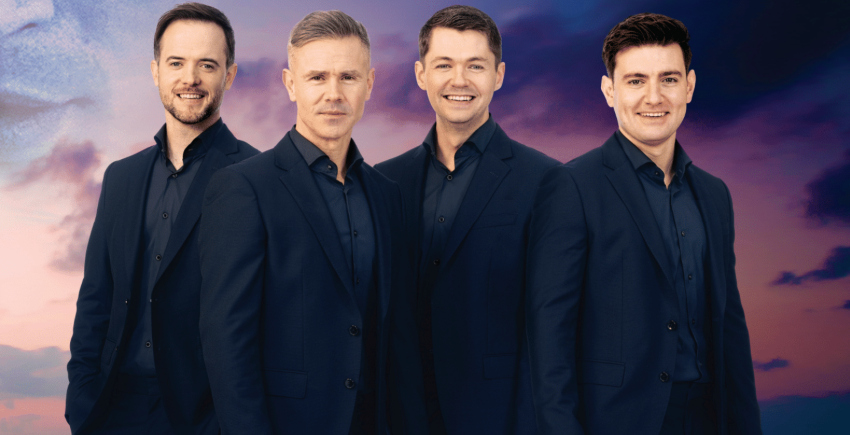 celtic thunder four men in dark navy suits looking forward smiling
